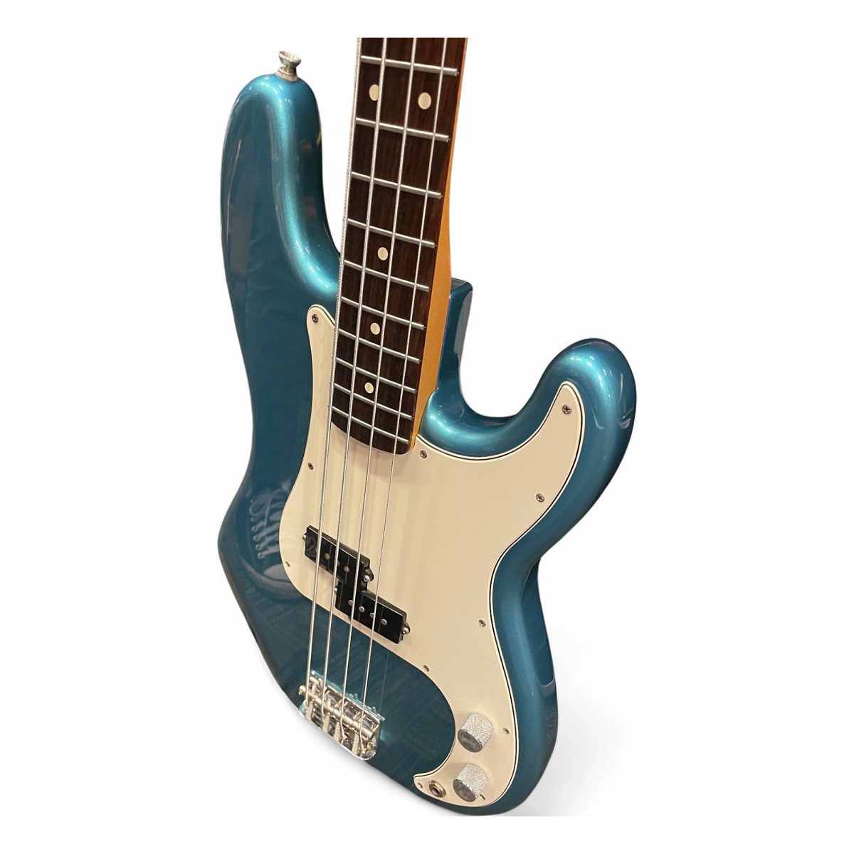 Three-quarter view of the Lake Placid Blue Precision Bass body, showing the metallic finish and rosewood fretboard
